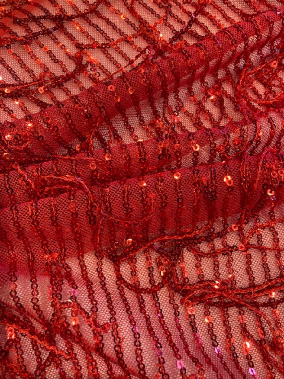 Red Sequin Tassel on Red Stretch Tulle. Tassels run across the piece.