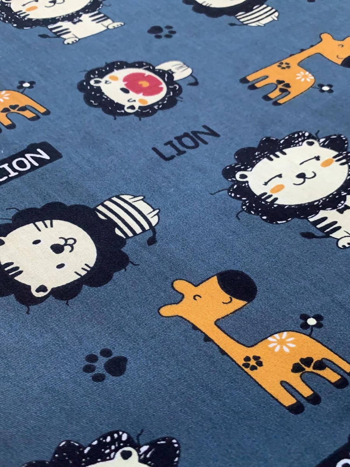 Lion and Giraffe on Teal Cotton Sateen - Deadstock fabric on AmoThreads